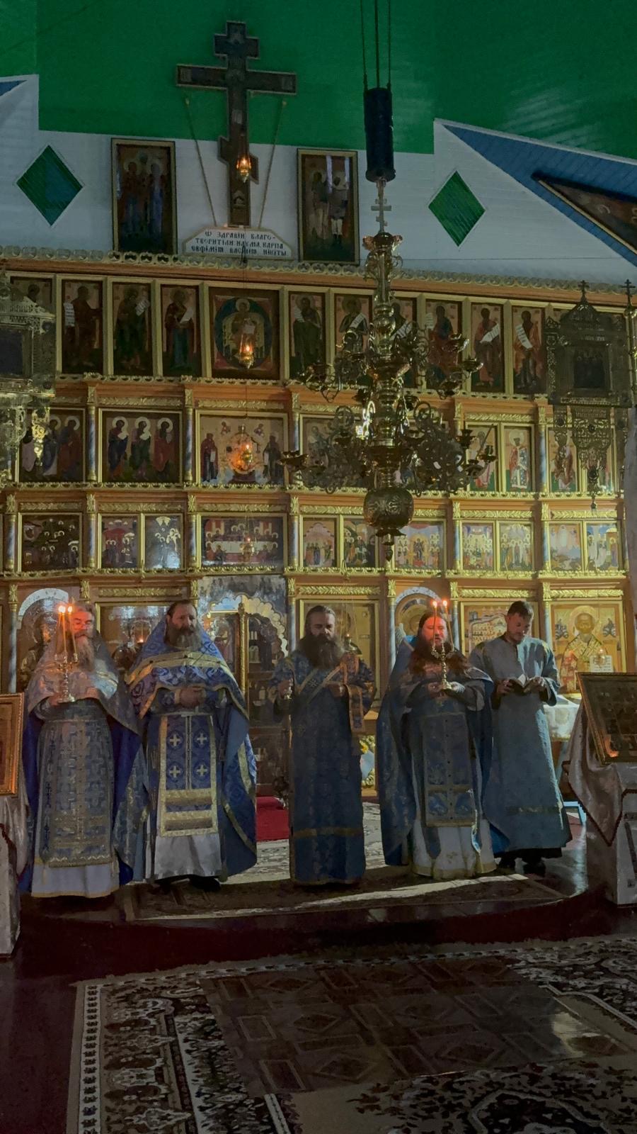 Clergy in blue vestments before the iconostasis